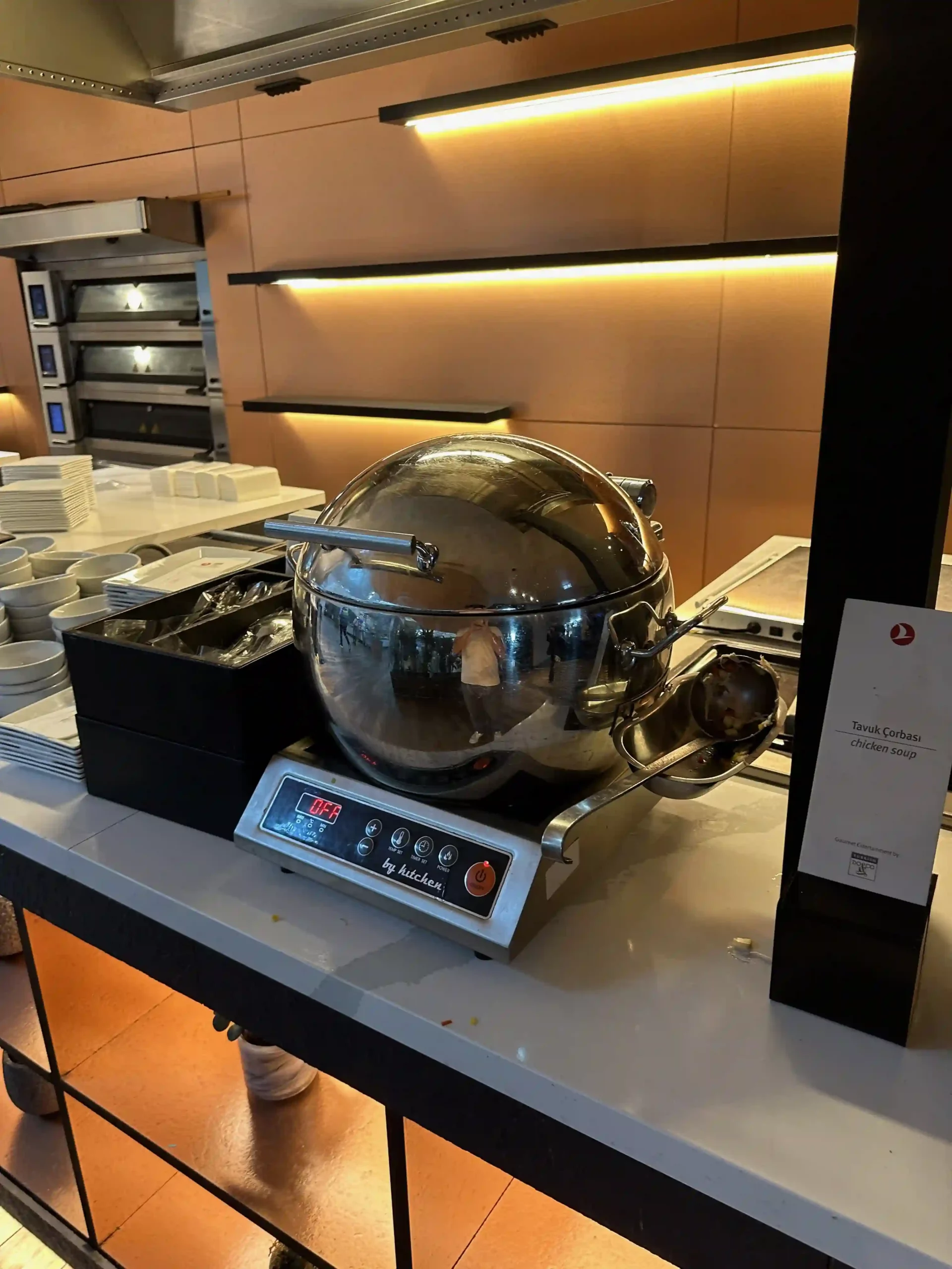 a large silver pot on a counter