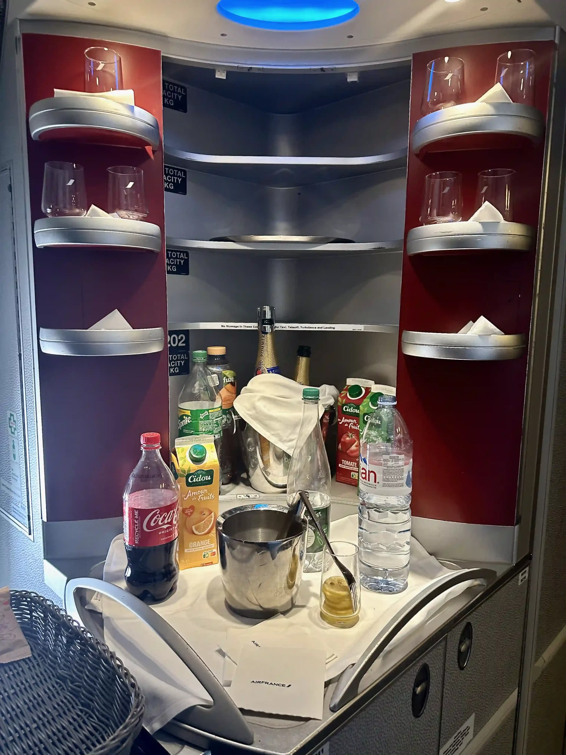 a shelf with drinks and bottles on it