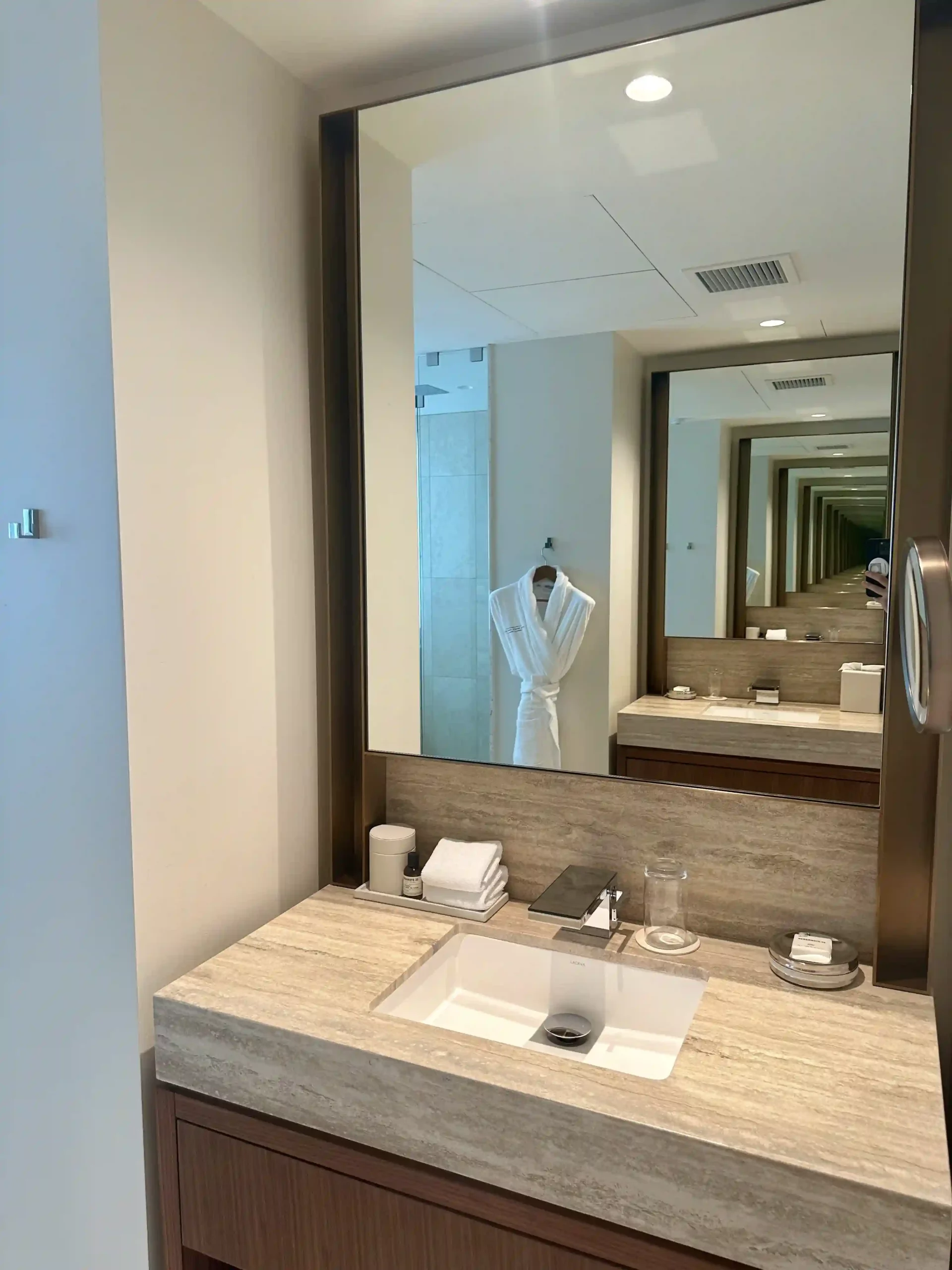 a bathroom with a mirror and sink