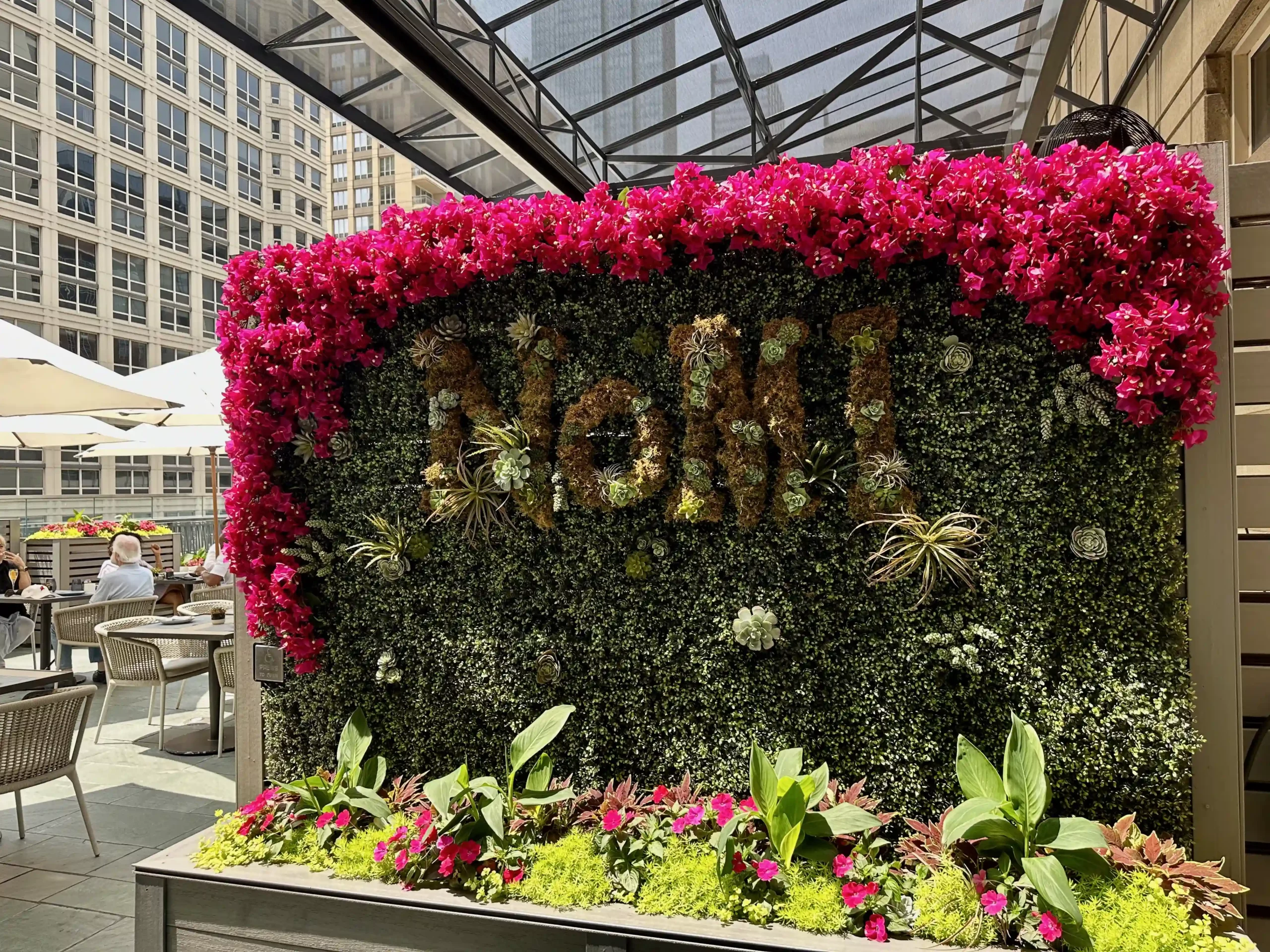 a sign with flowers on it