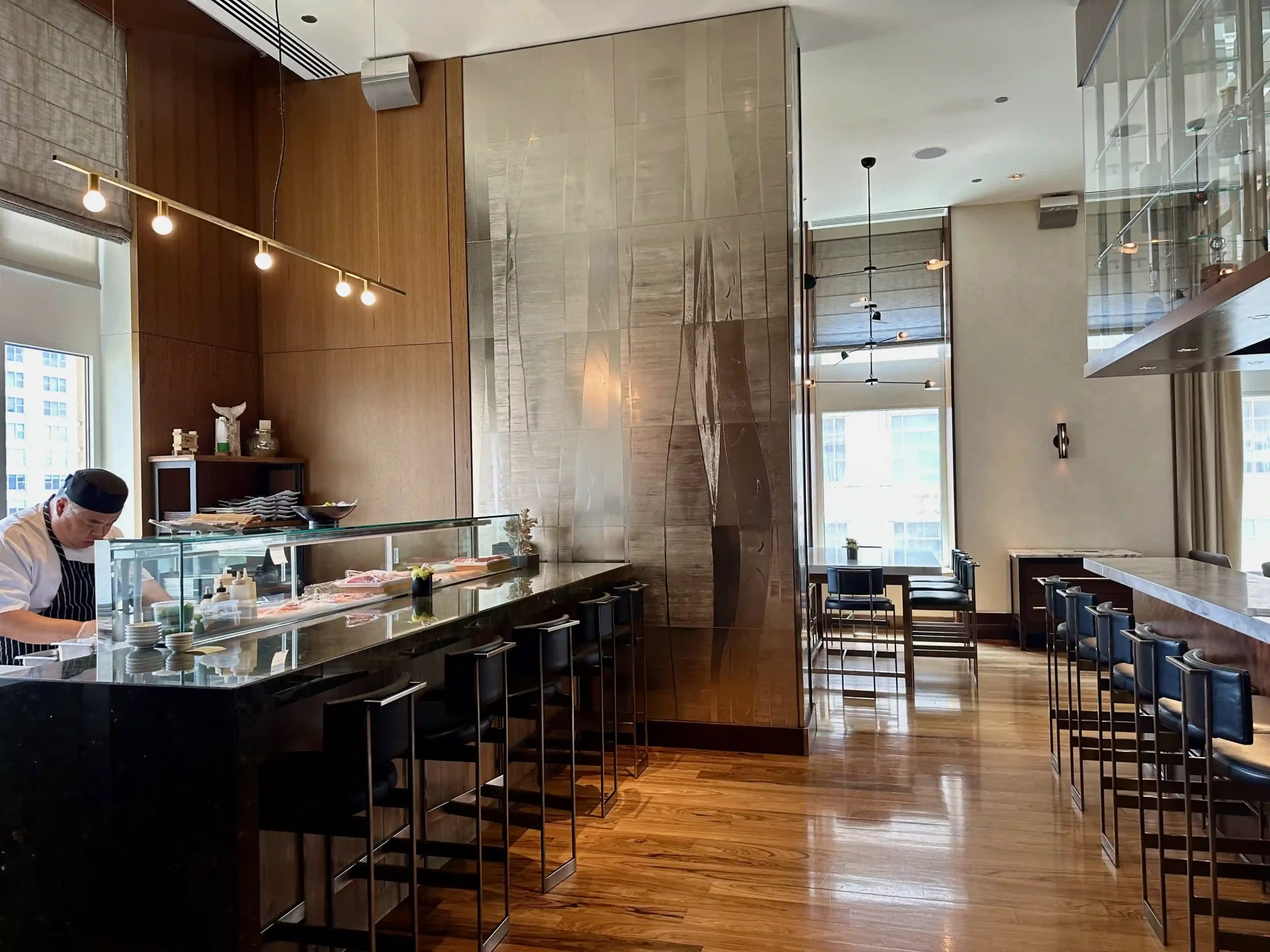 a restaurant with a counter and chairs