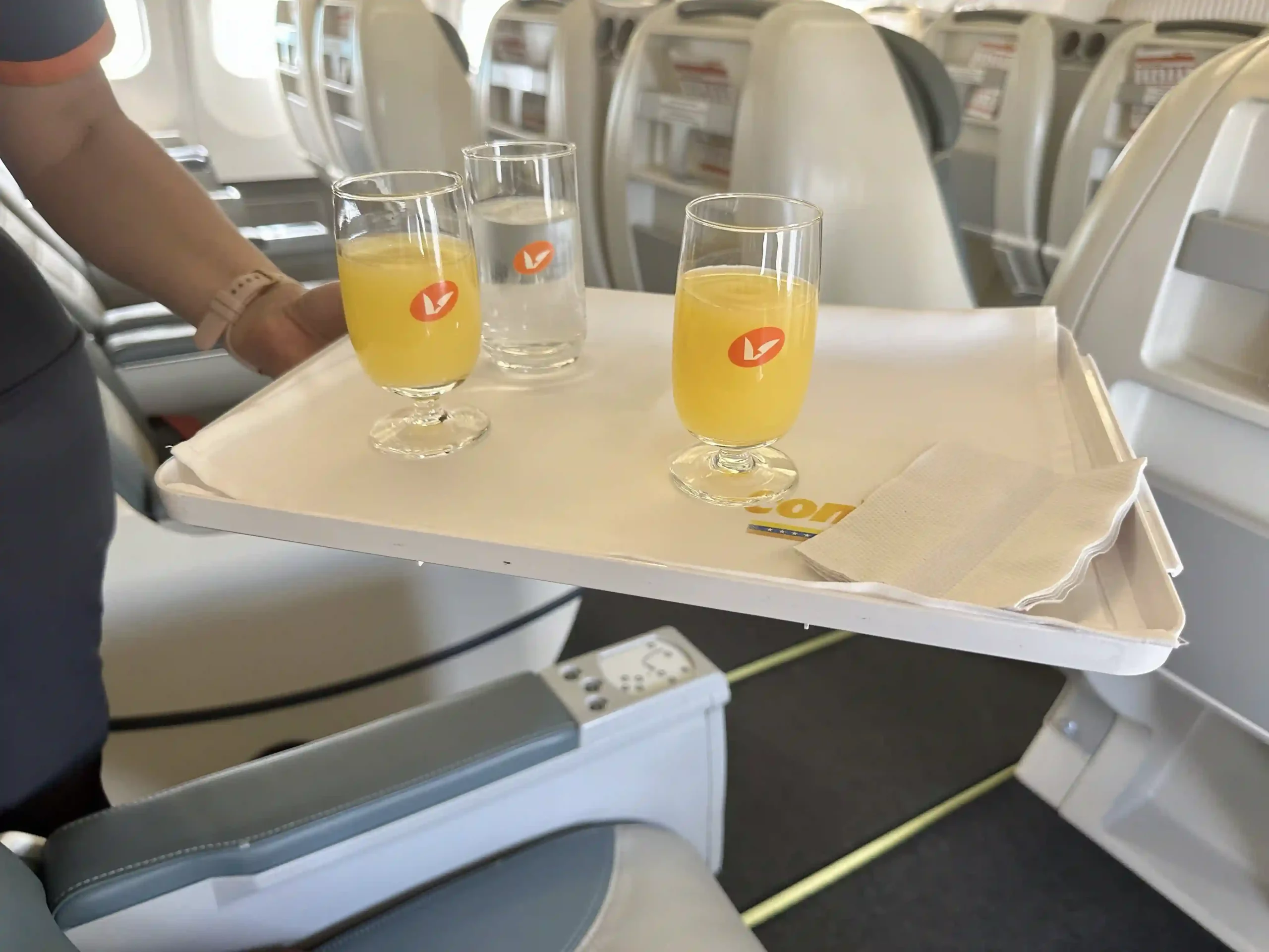 a tray with glasses of orange juice on it