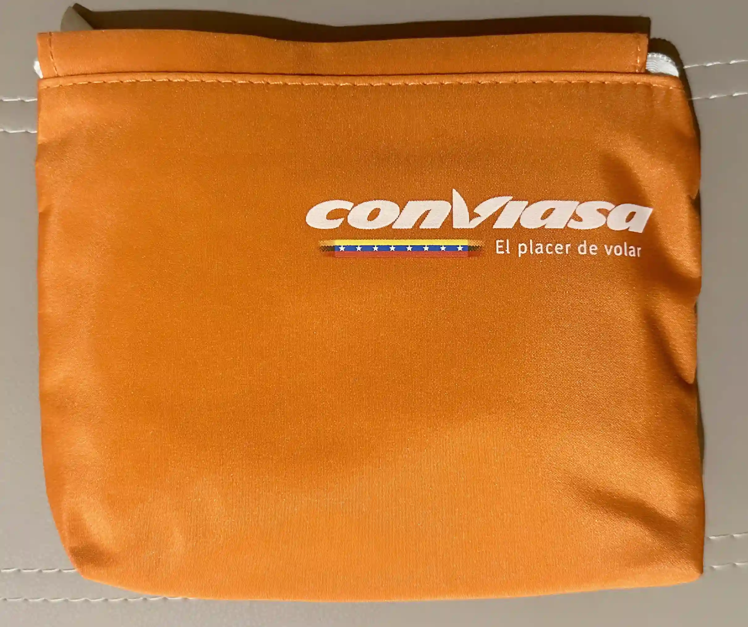 an orange pouch with a logo on it