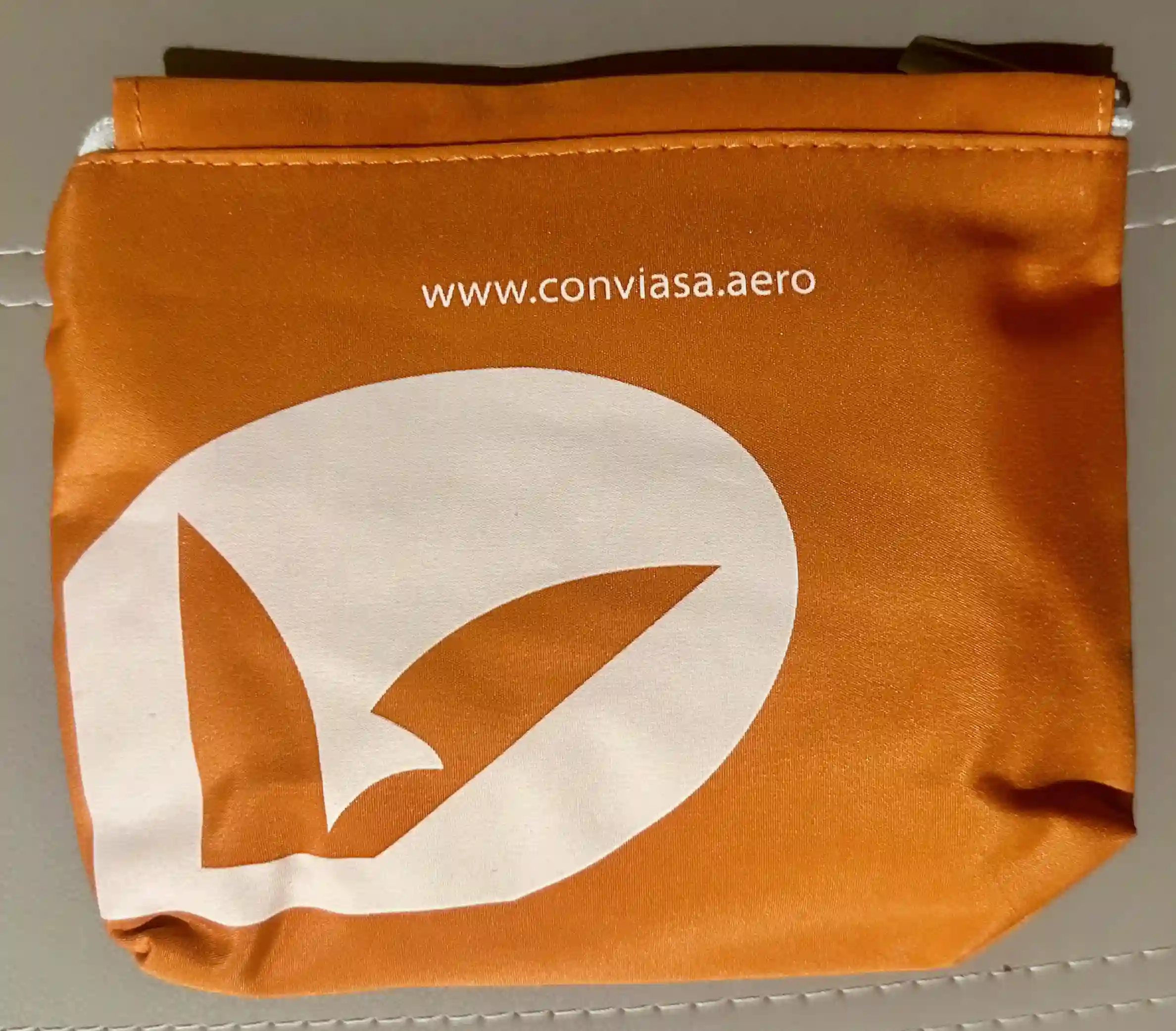 an orange bag with a white circle on it