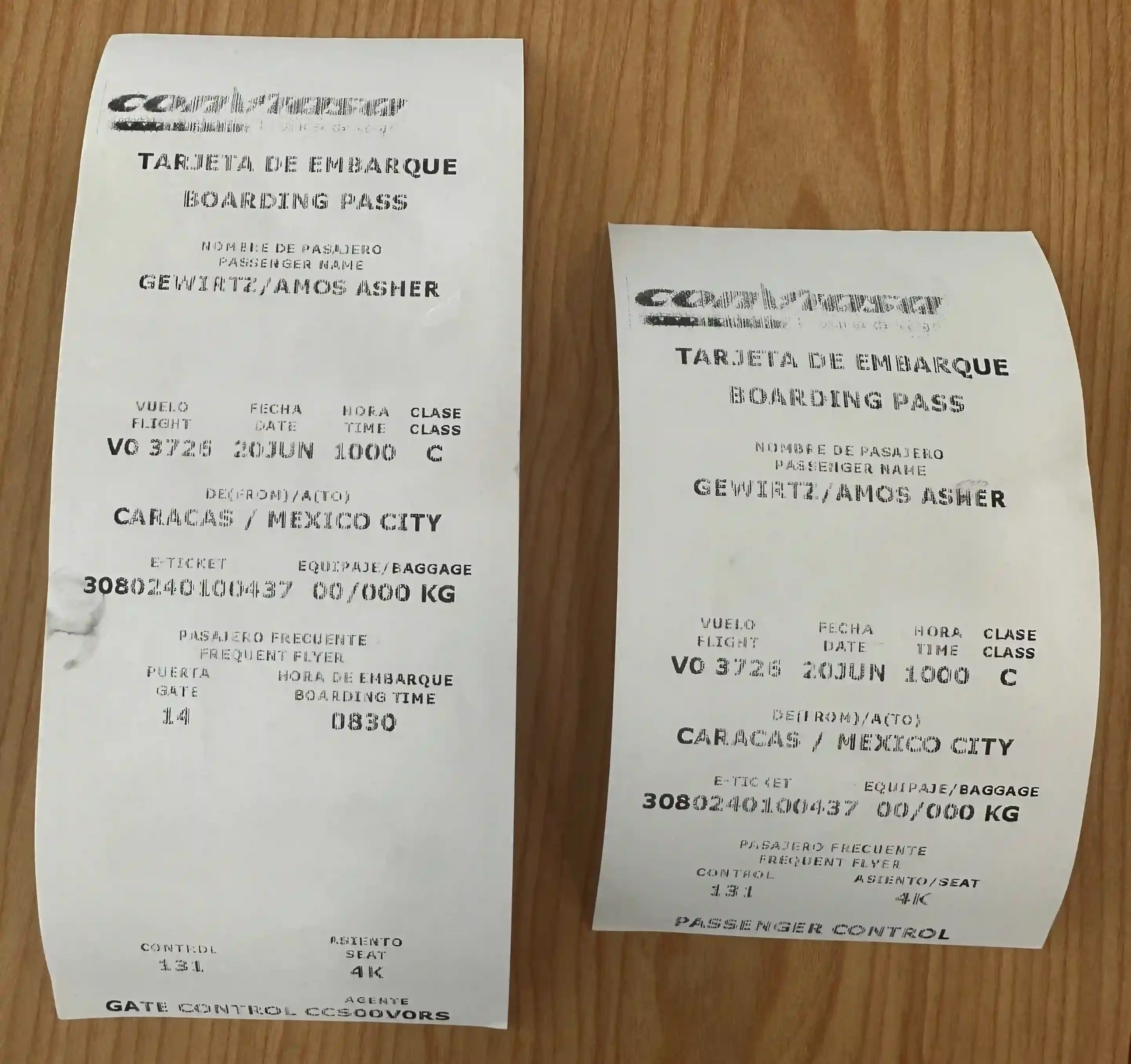 a pair of receipt on a wood surface