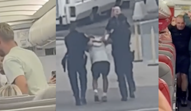 Unruly man being removed from plane