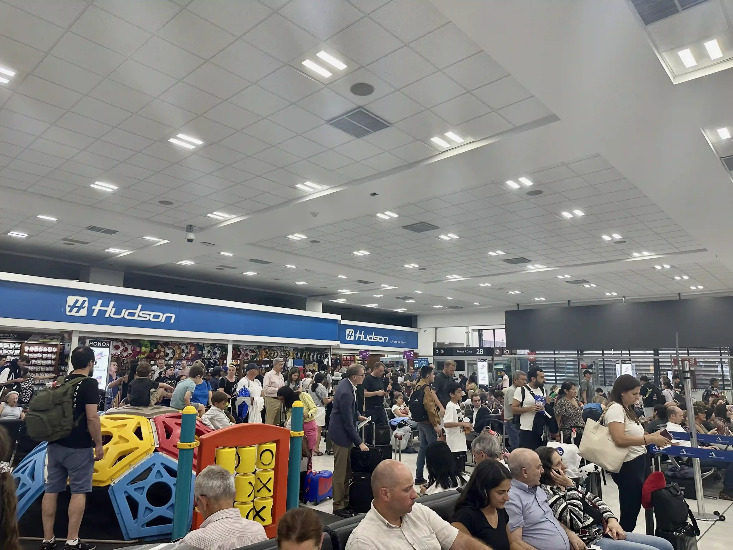 a large crowd of people in a large airport