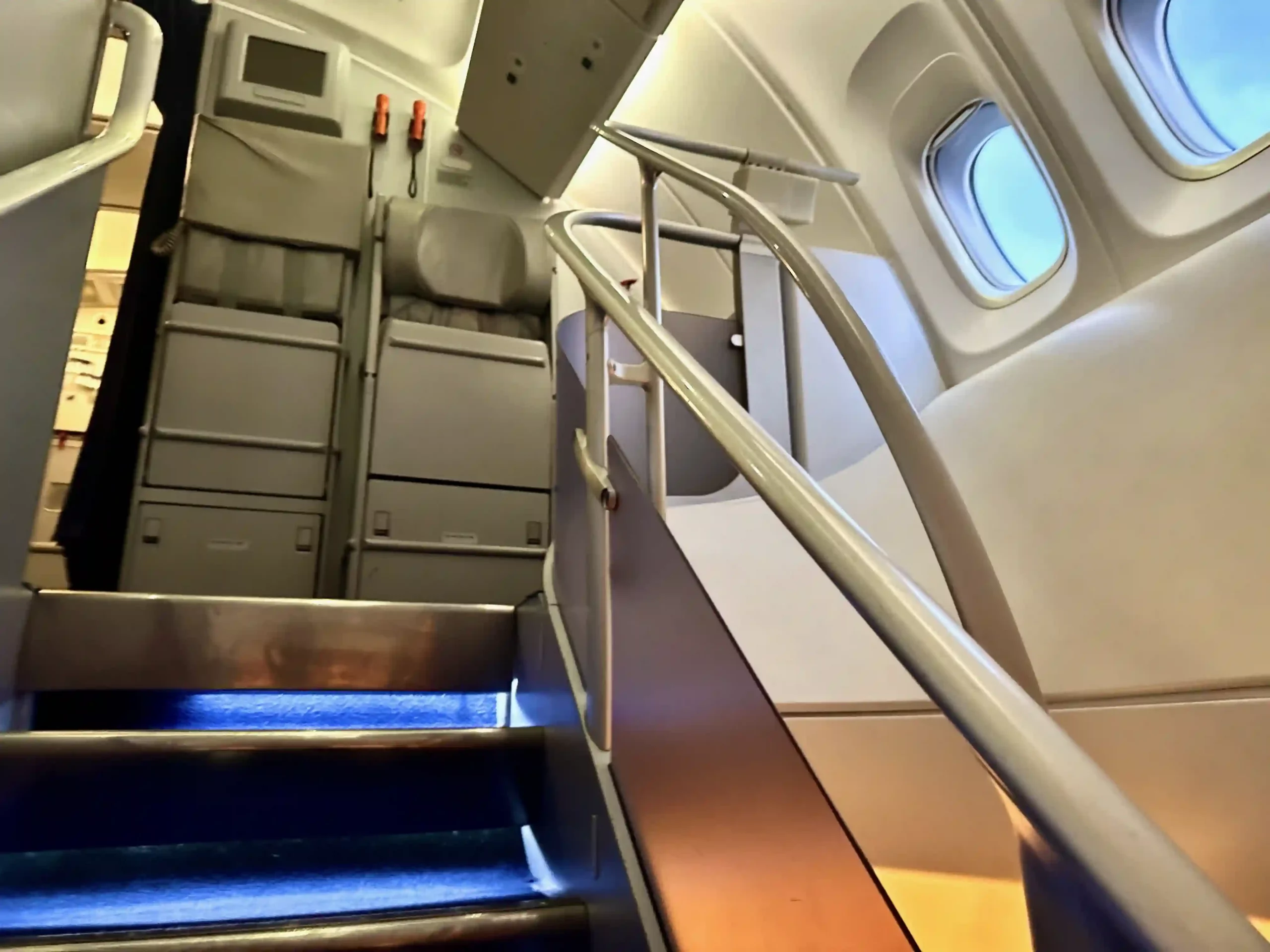 a plane with a staircase and a window