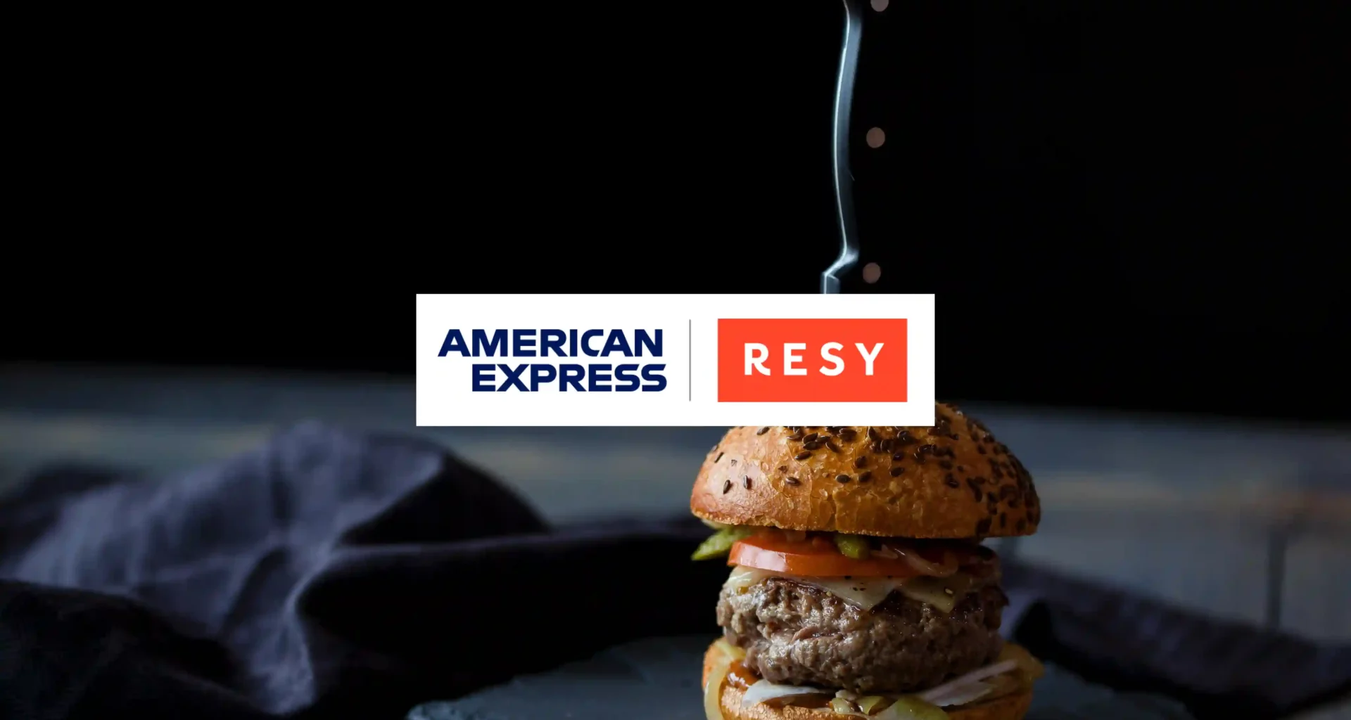 American Express and Resy logos on top of burger