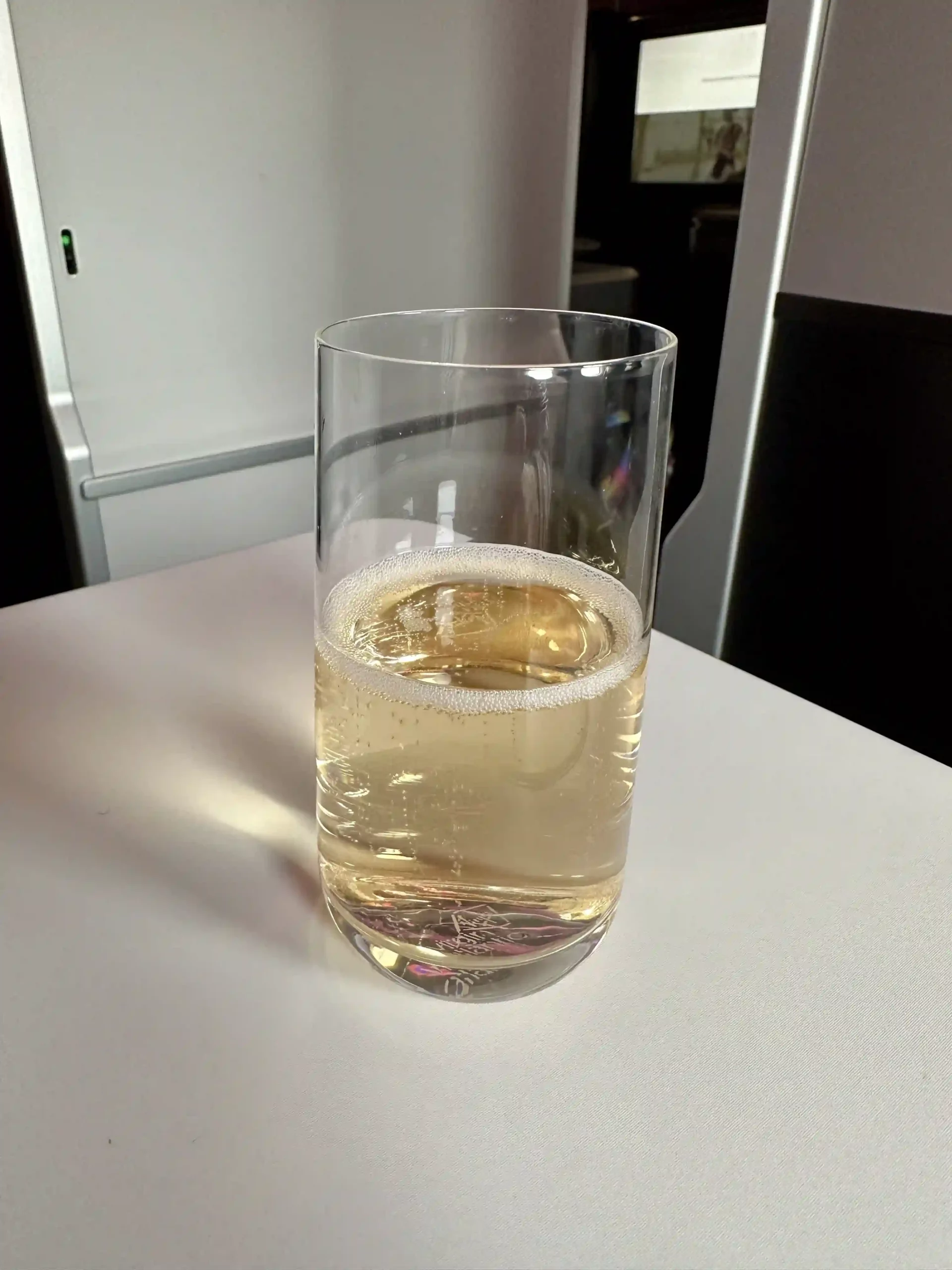 a glass of liquid on a table