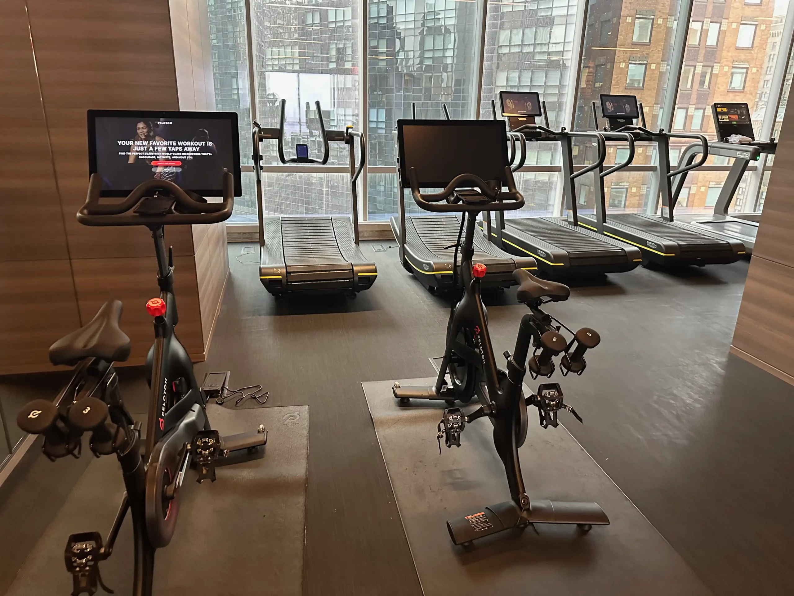 a room with exercise bikes and treadmills