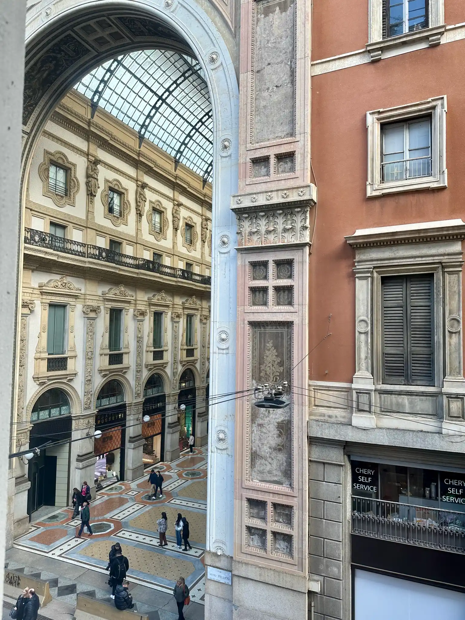 a group of people walking through a building