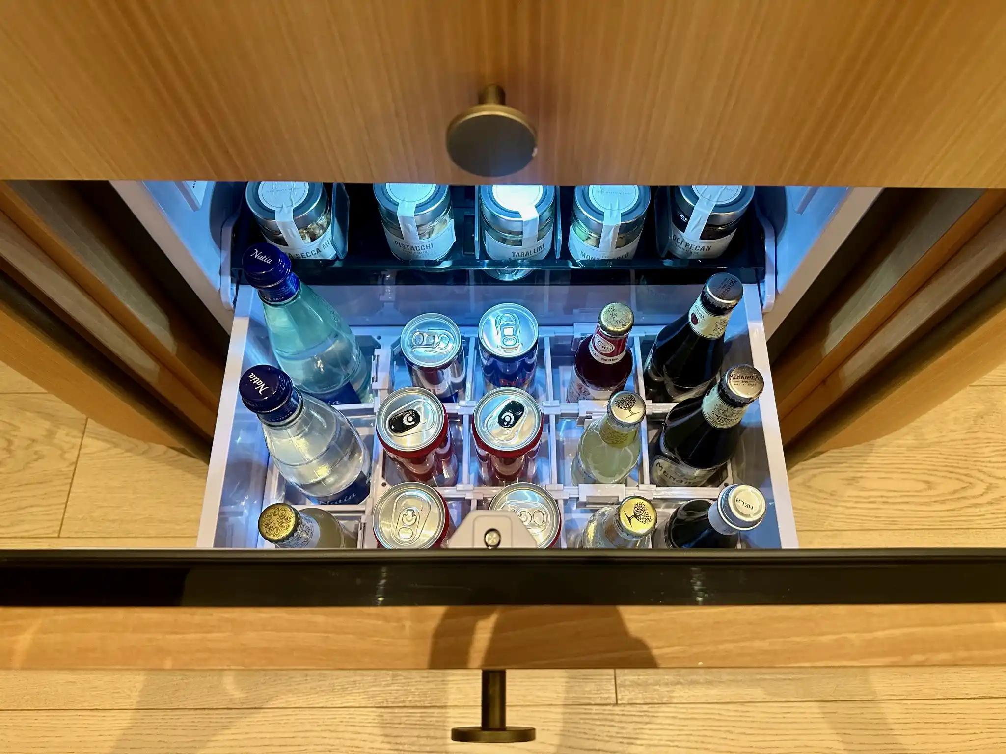 a drawer with bottles in it