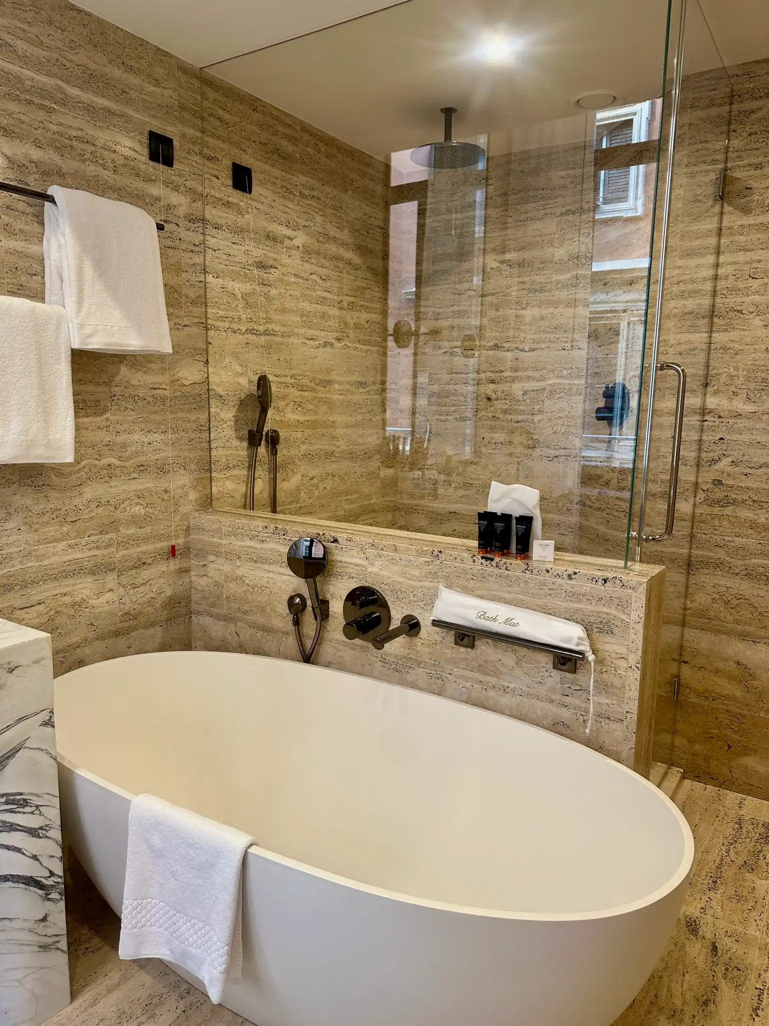 a bathroom with a bathtub and shower