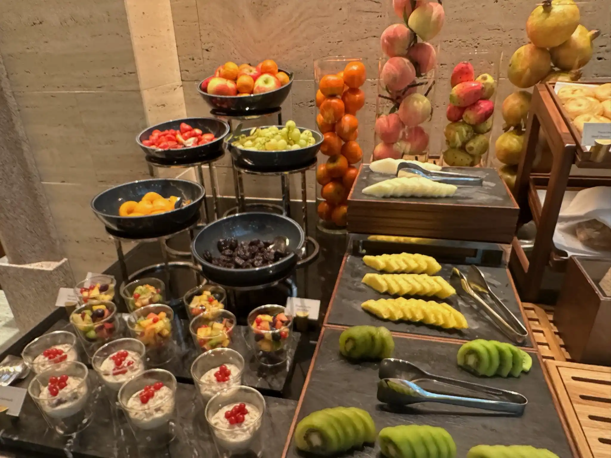 a table with fruit and desserts