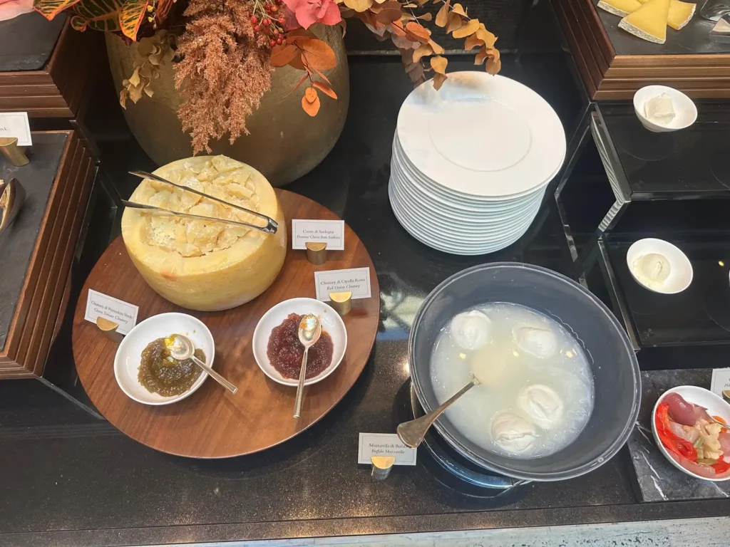 a table with plates and bowls of food