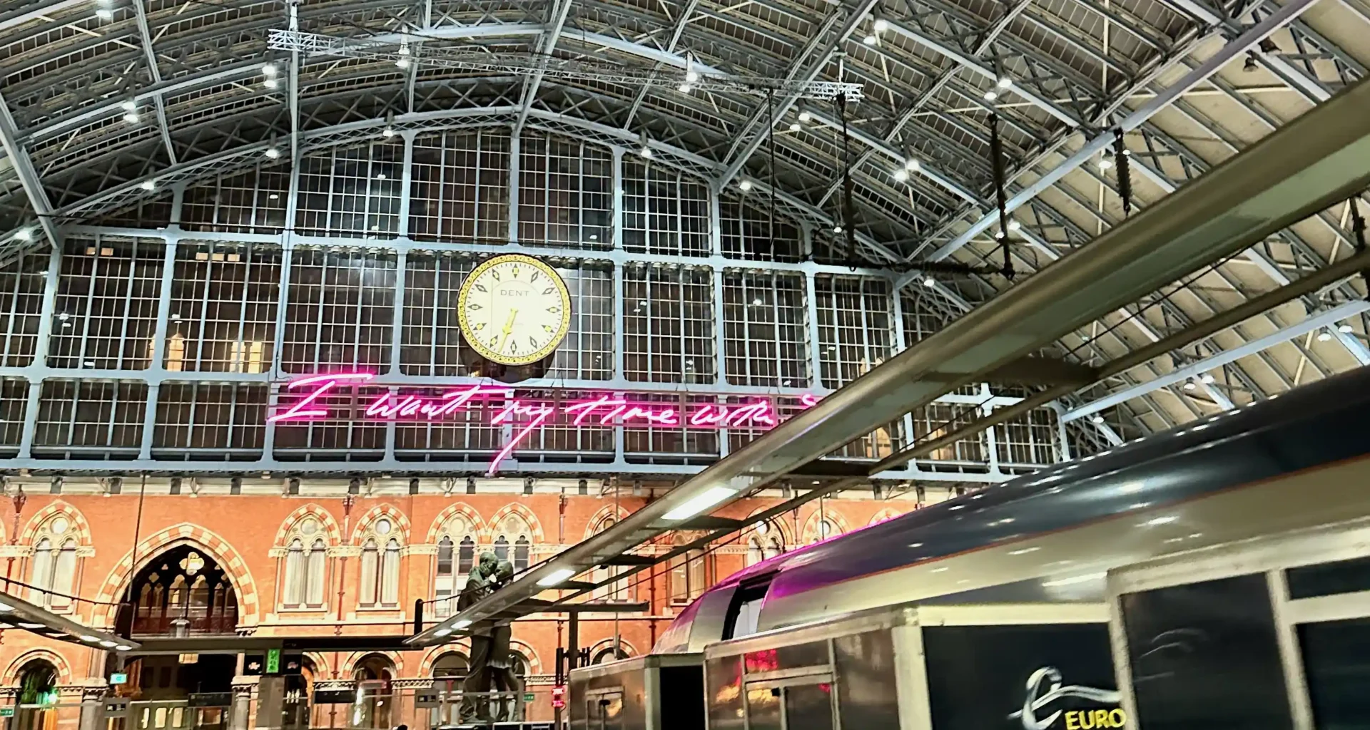 a train station with a clock