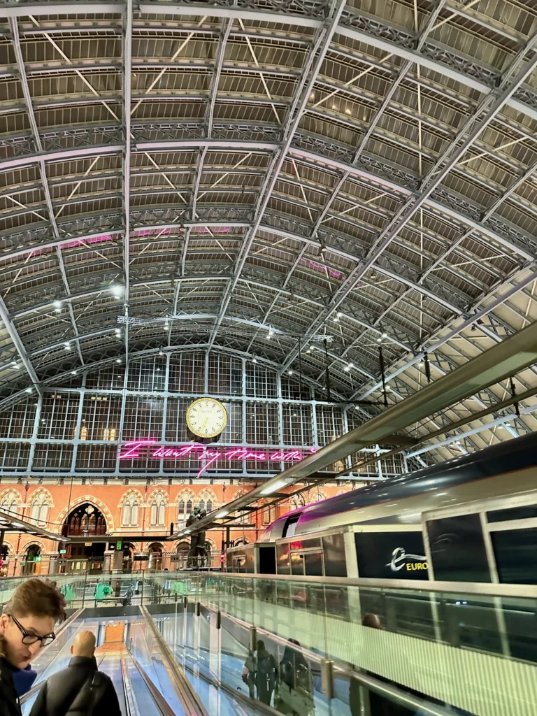 a train station with a clock