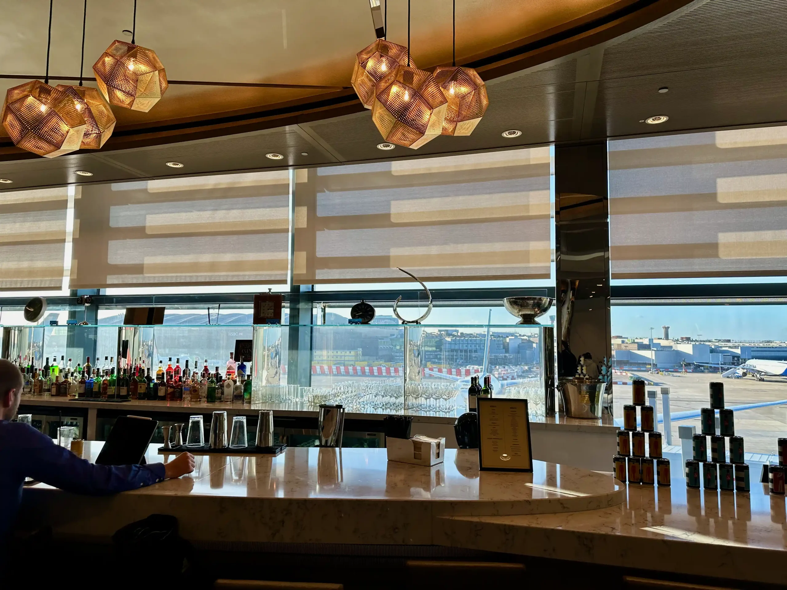 a bar with a person sitting at the counter