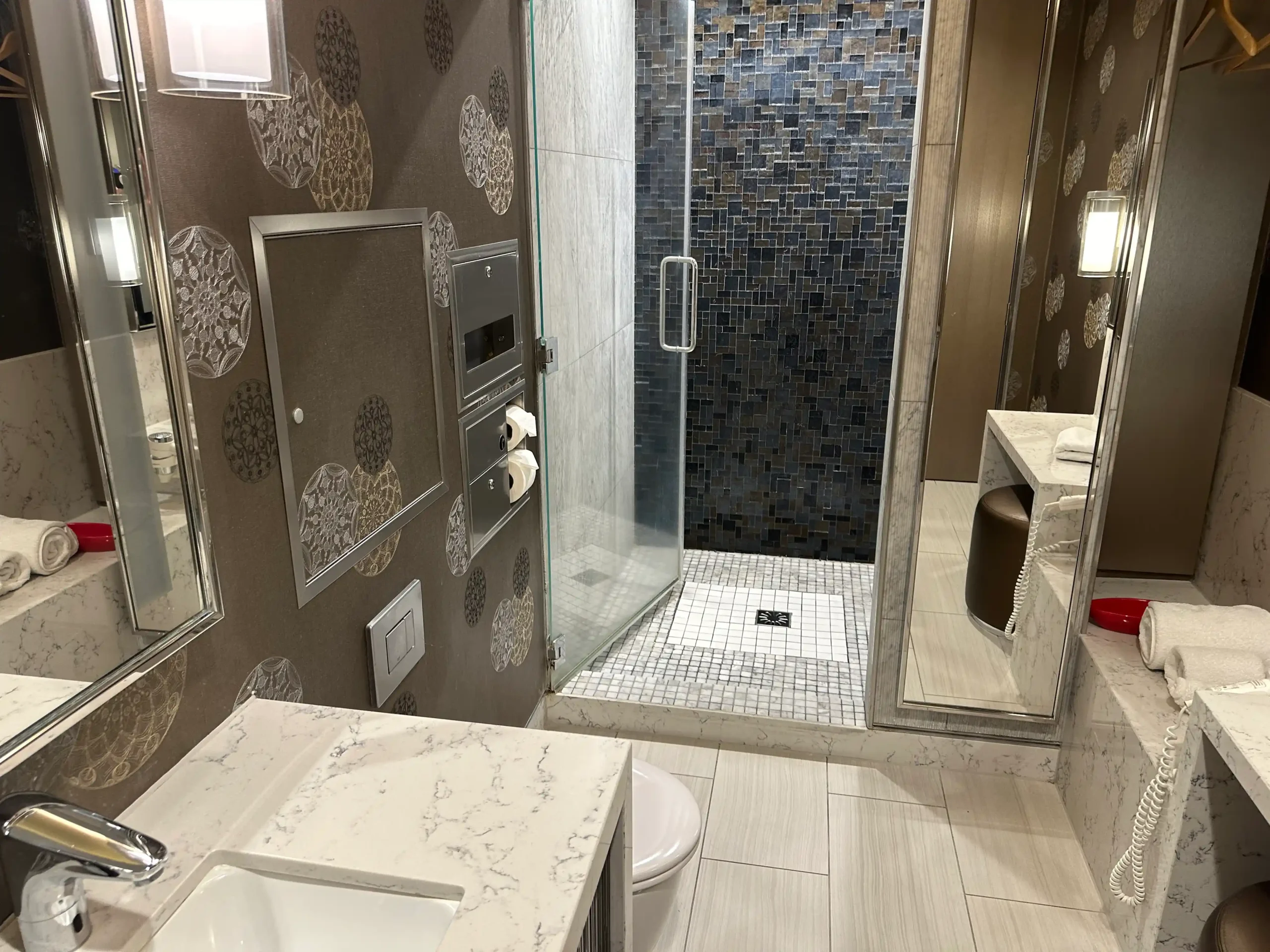 a bathroom with a shower and sink