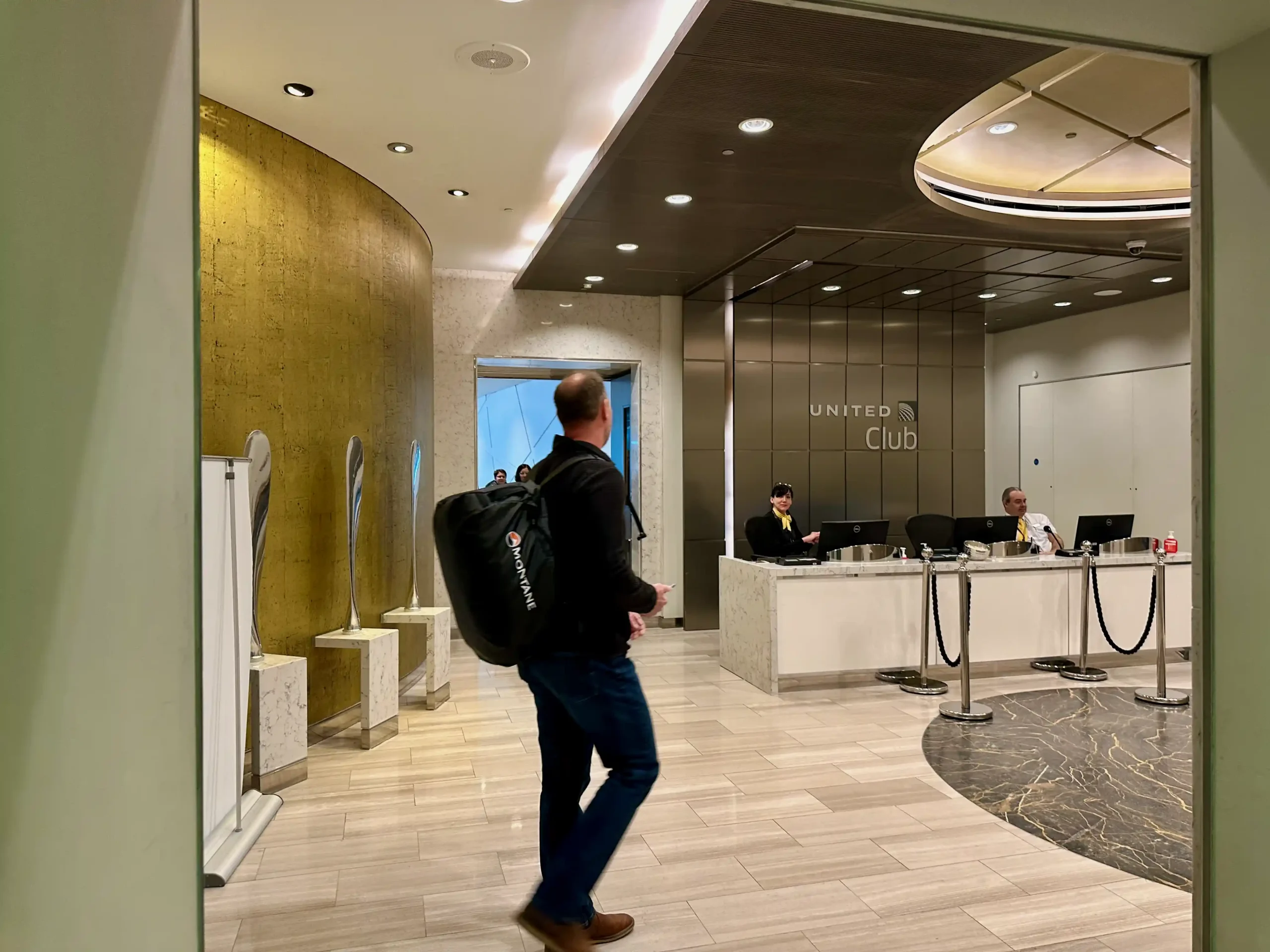a man walking in a lobby