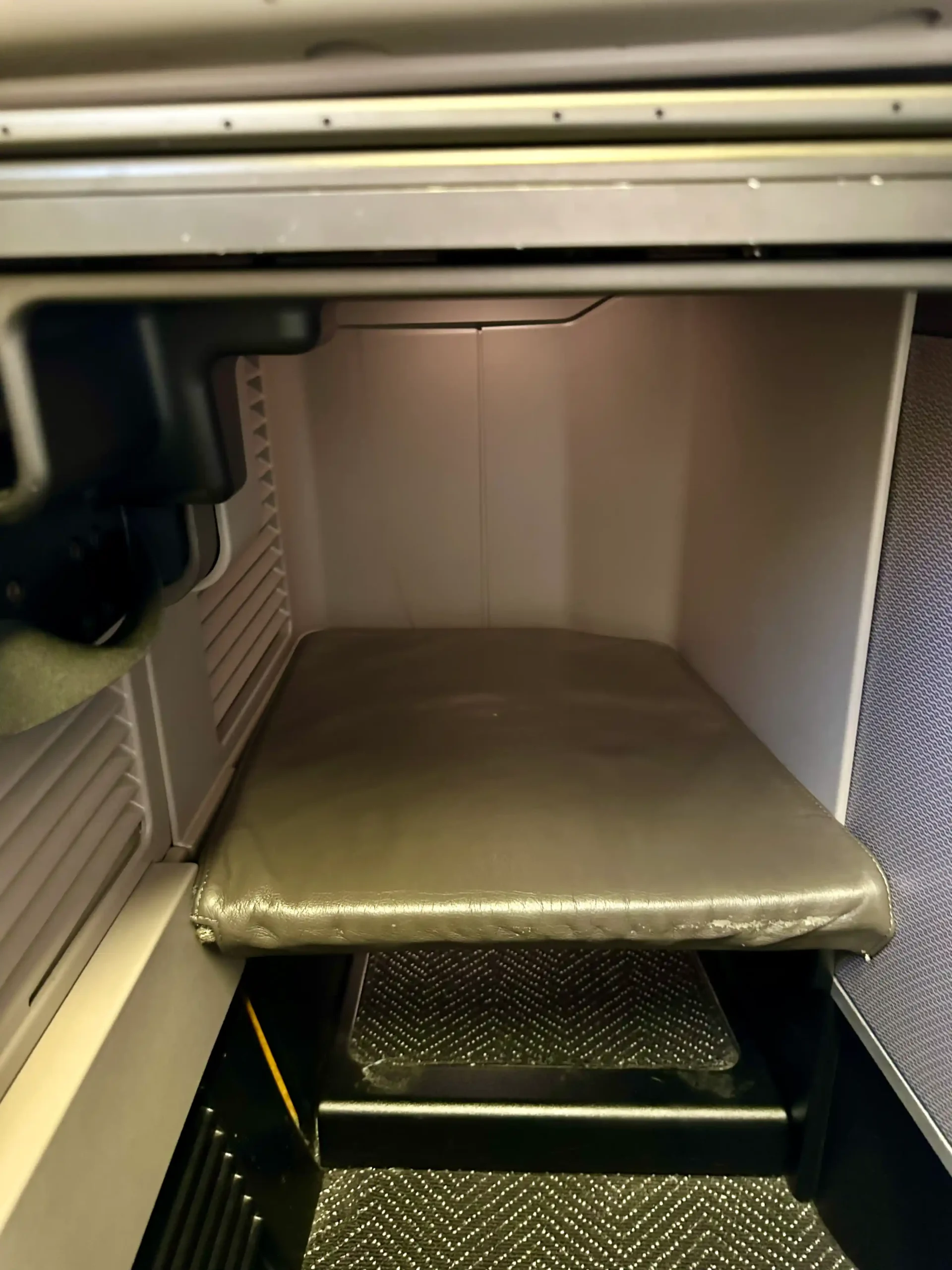 a seat inside a metal box