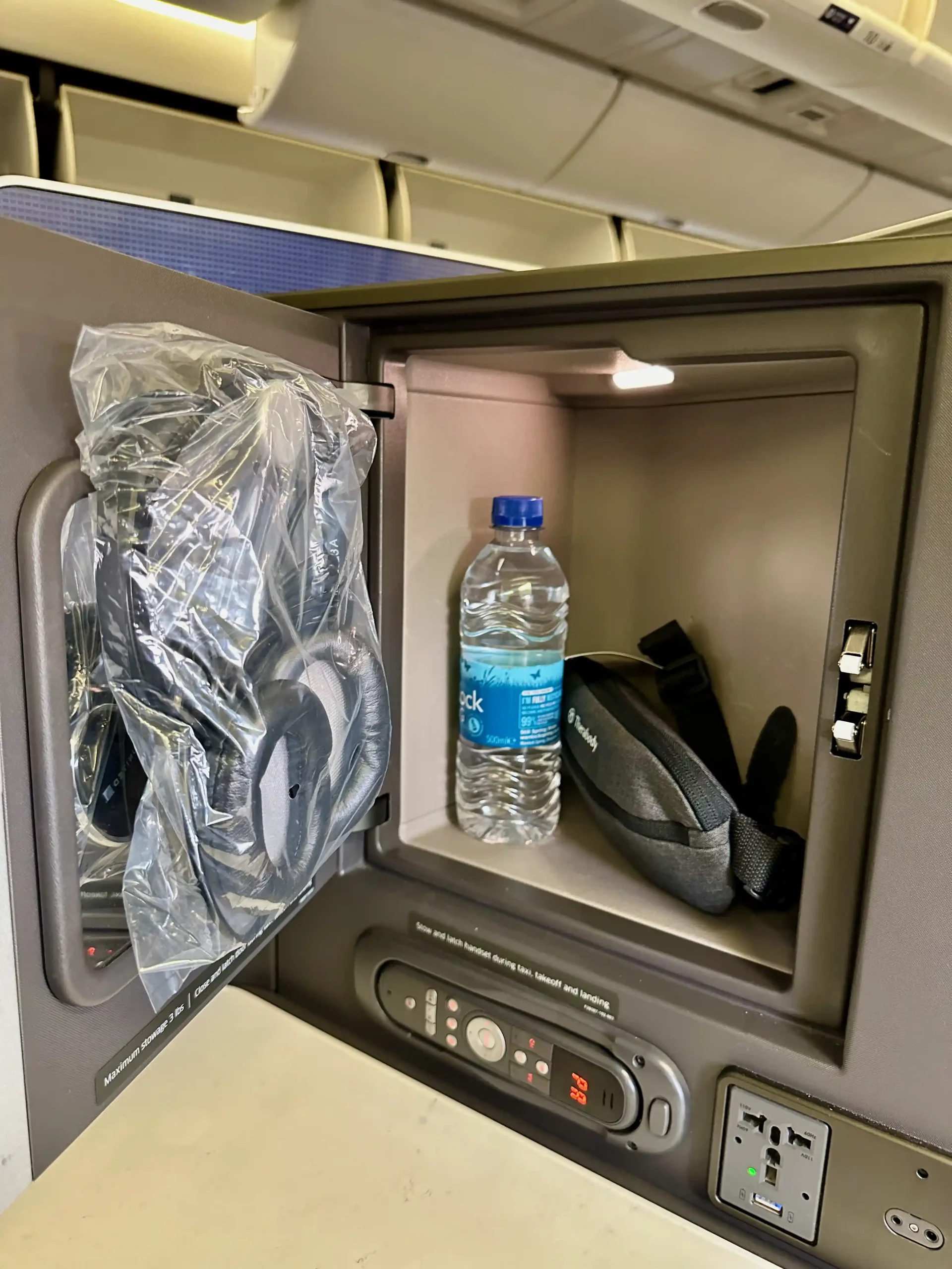 a small safe with a bottle of water inside