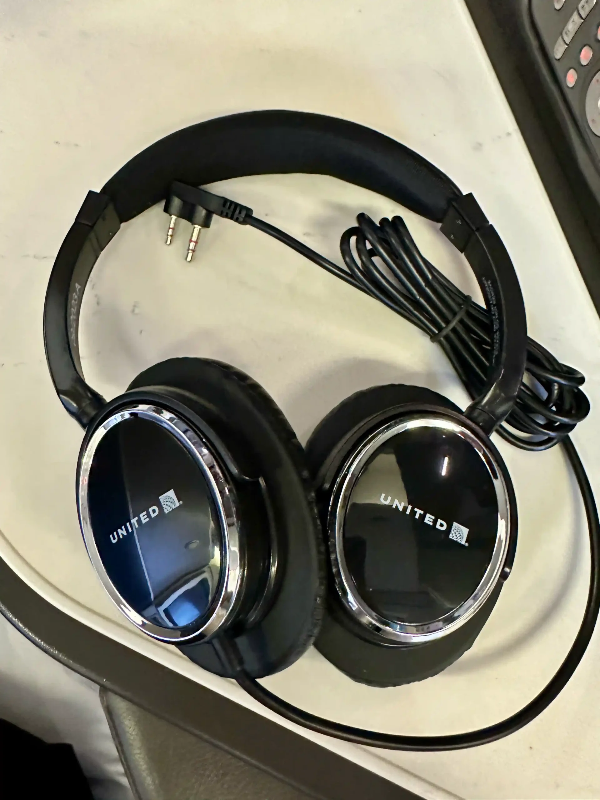 a pair of headphones on a white surface