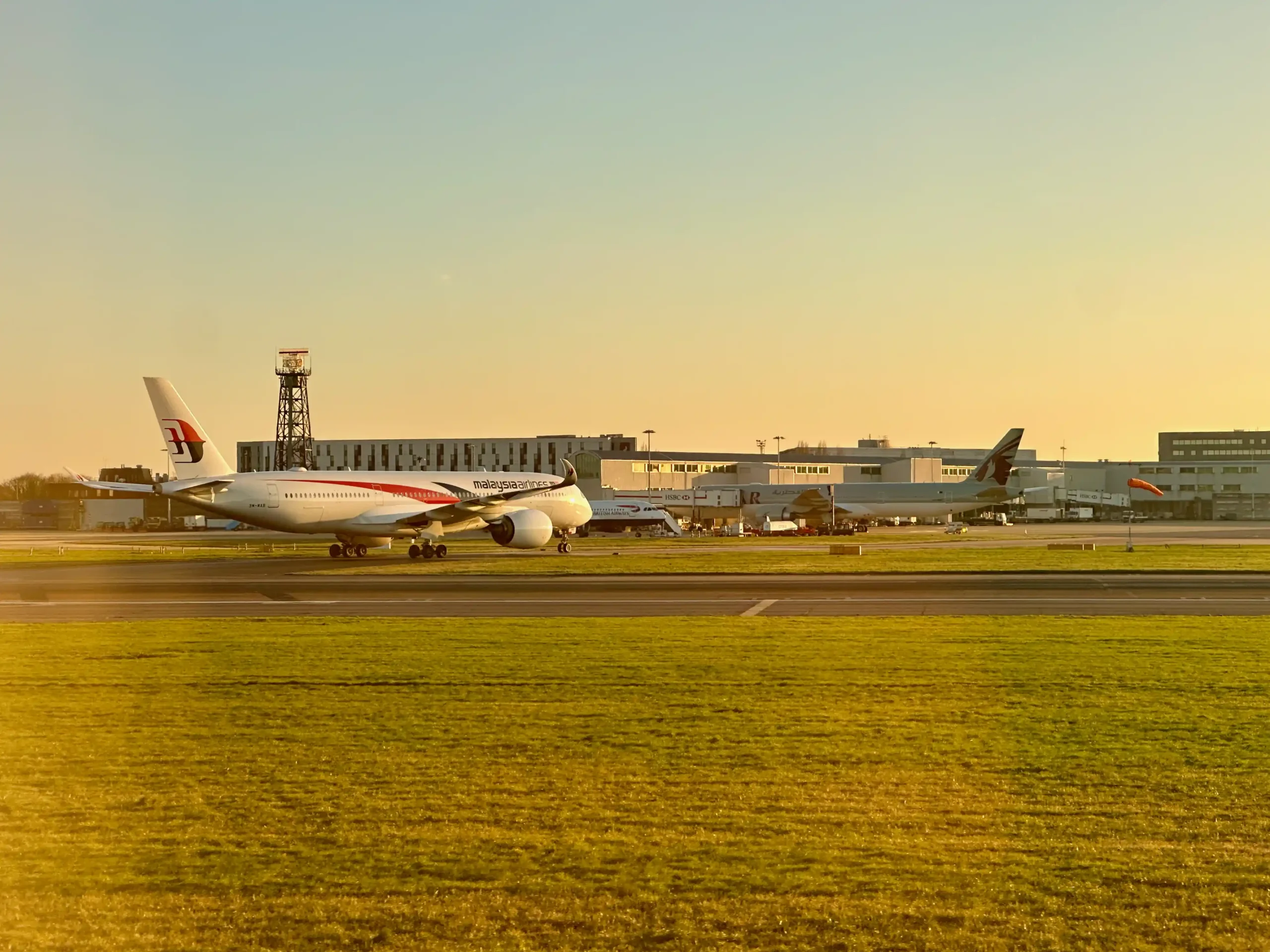 a group of airplanes on a runway