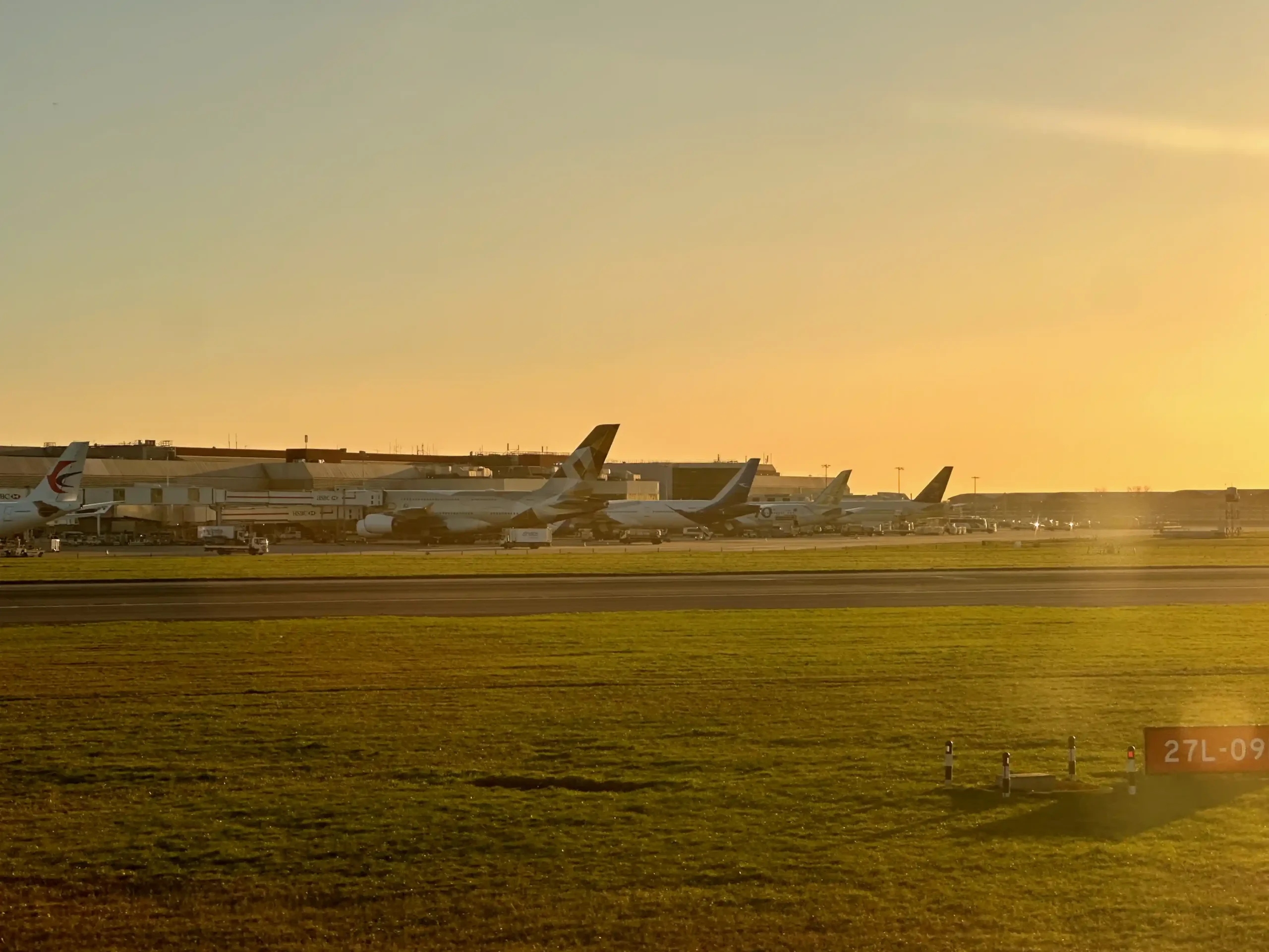 a group of airplanes on a runway