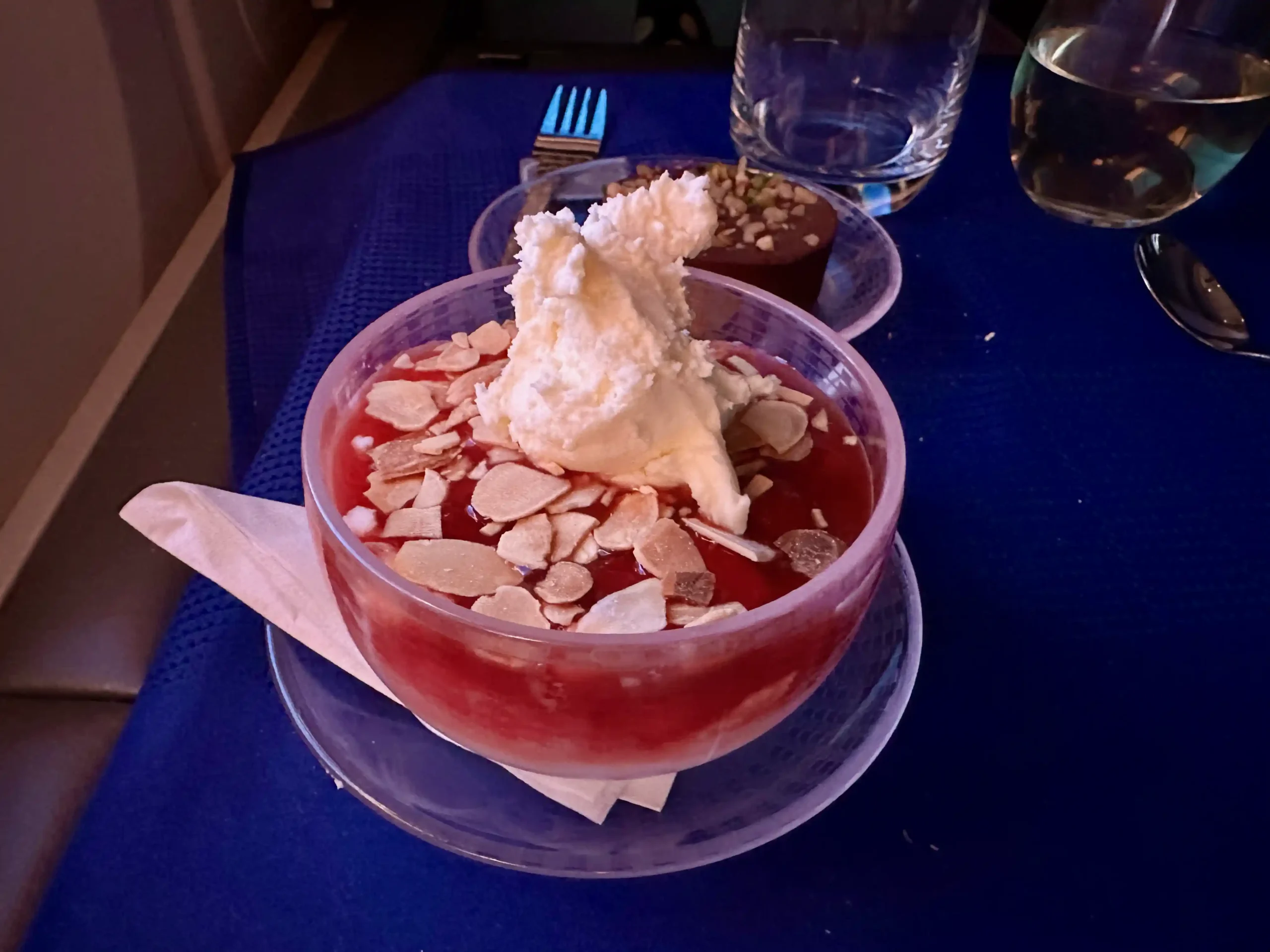 a bowl of dessert with a scoop of ice cream on top