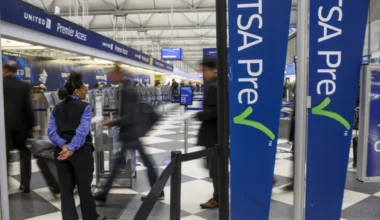 people walking through an airport