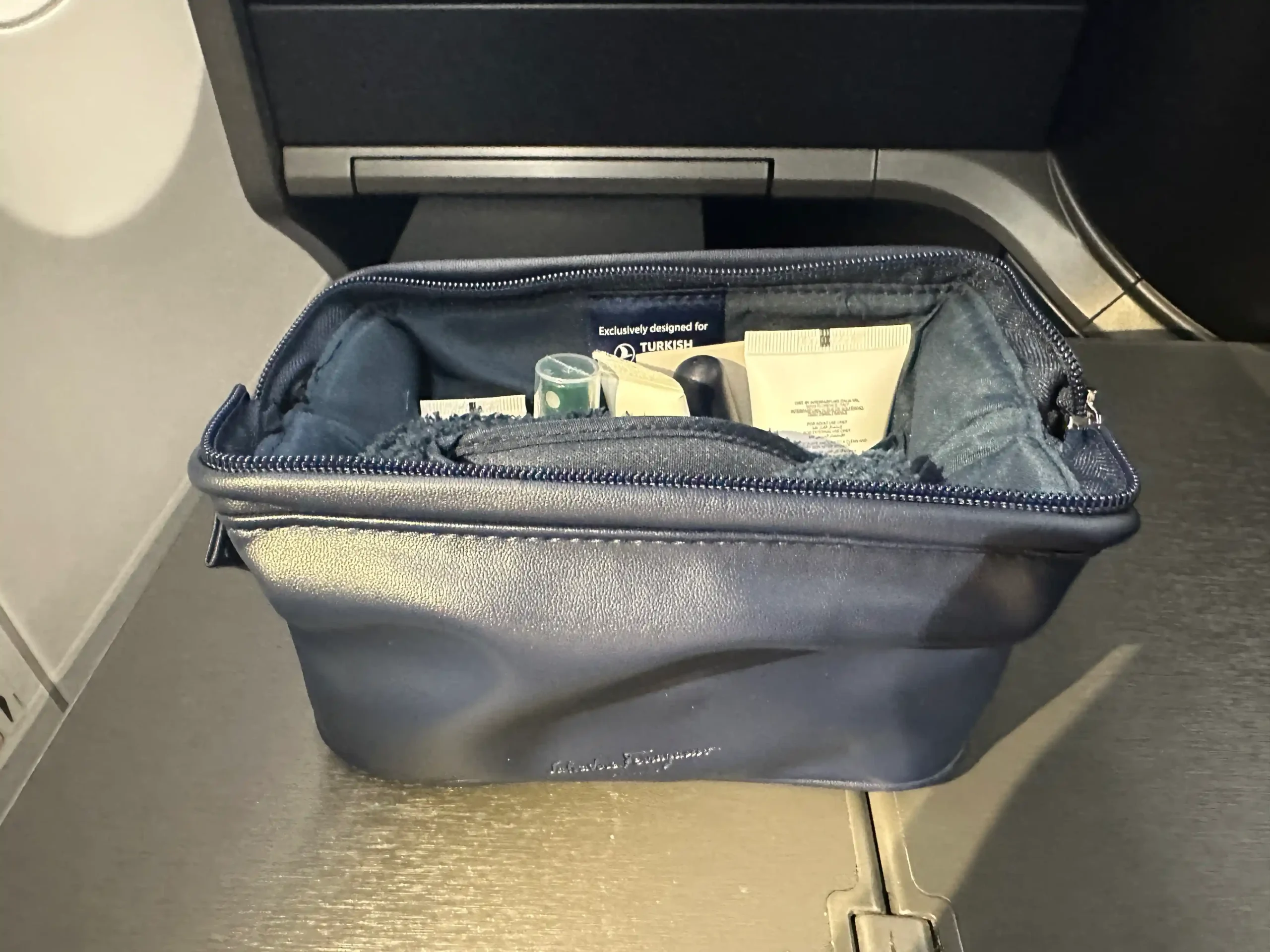a blue bag with a few items inside