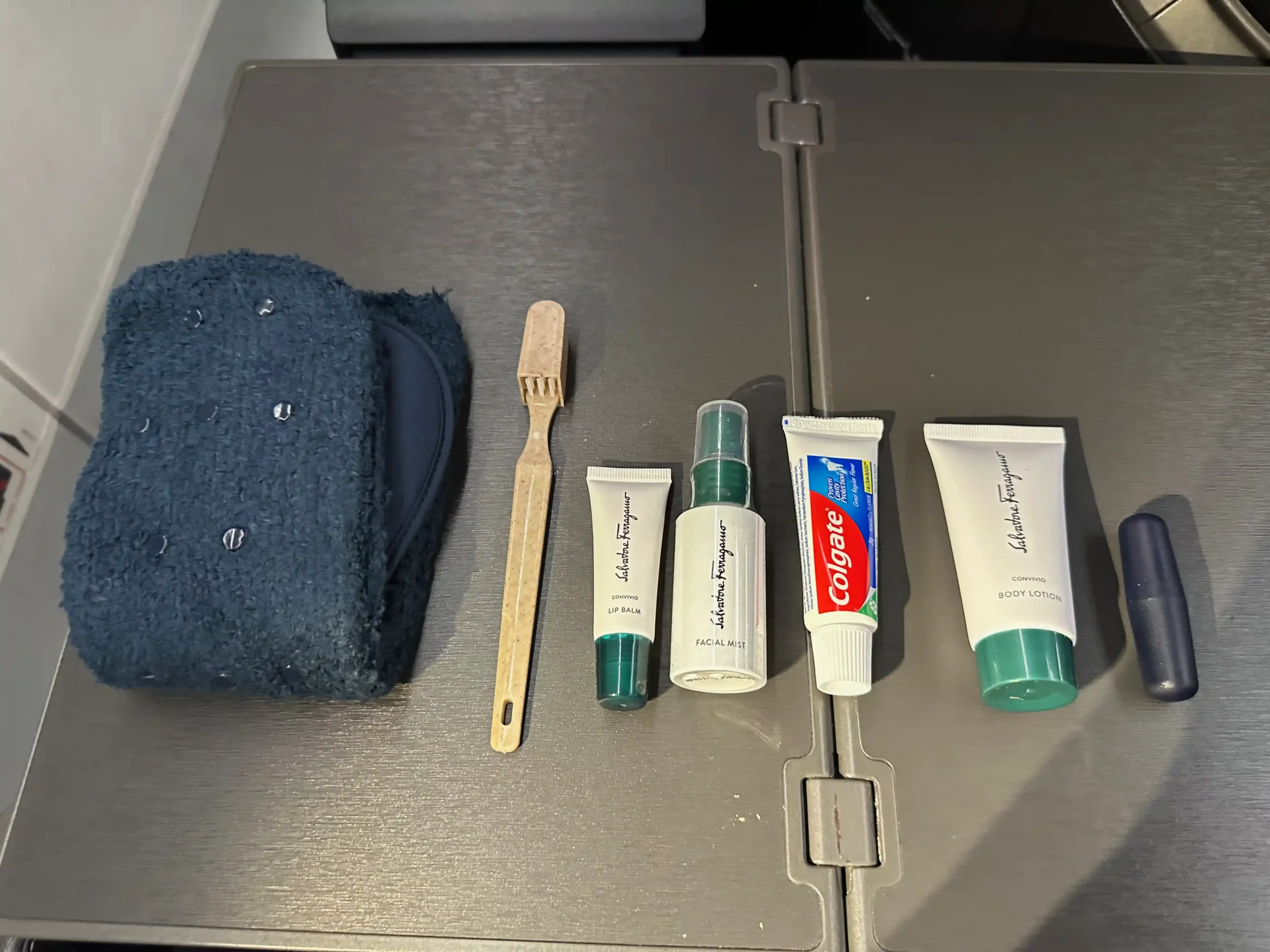 a group of toiletries and toothbrushes on a table