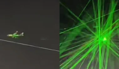 An airplane being targeted by hundreds of green laser pointers